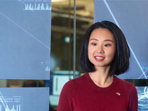 Girl standing in front of tech display