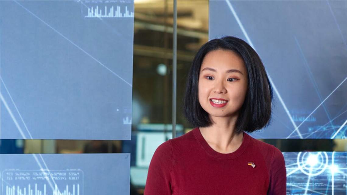 Girl standing in front of tech display