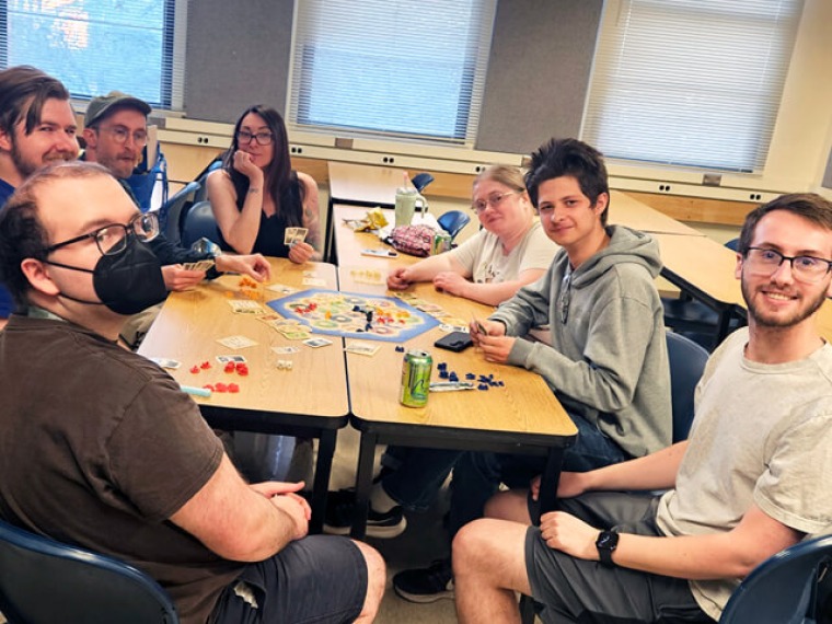 Group of students playing Catan