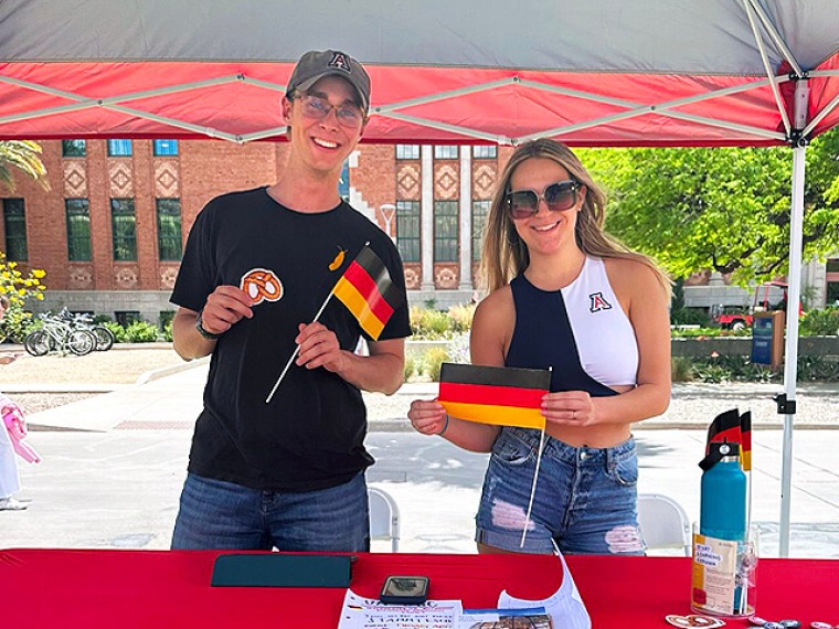 Two German Club officers at a tent on the mall