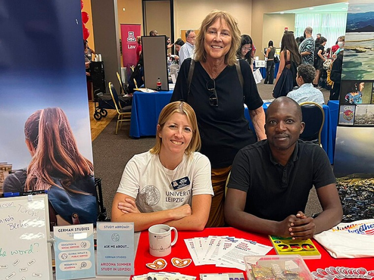 Faculty members at a student information table